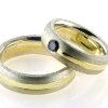 Billede af 1 par vielsesringe, damering fattet sort brill. 0,20 ct.  925s og 18 kt.