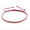 Billede af By Pind Colorful knyttet armbånd fuchsia og guldfarvet med sølv forgyldte kugler