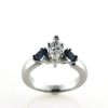 Billede af Ring med diamant marquise cut 0,47 ct. w/vs1 + 2 safirer trillion cut a 0,28 ct. 14 kt. hvg.