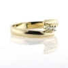 Billede af Ring forskudt, grabbe fatning 2 stk. 2 m/m. syn. stene. 14 kt.