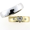 Billede af 1 par vielsesringe, damering fattet med hjerte diamant 14 kt. og 14 kt. hvg.