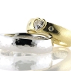 Billede af 1 par vielsesringe, damering fattet med hjerte diamant 14 kt. og 14 kt. hvg.