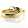 Billede af 1 par ringe, hr. ring br. 5 mm. D-ring med hvg. fattet 1 brill. 0,03 ct. green, 14 kt.
